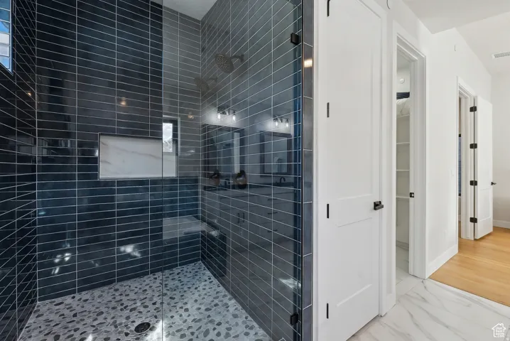 Full bathroom with a shower stall