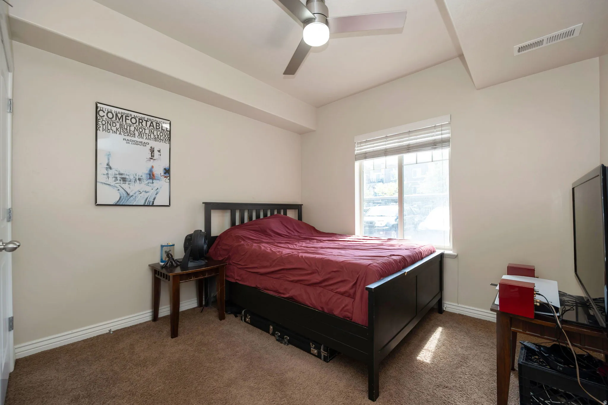 Bedroom with carpet flooring and a ceiling fan