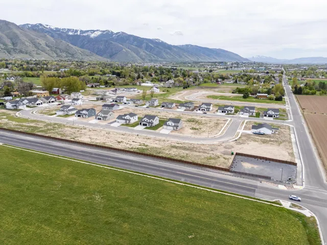 Aerial view of residential area featuring a mountainous background