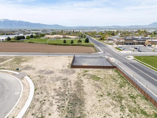 Aerial perspective of suburban area featuring a mountainous background