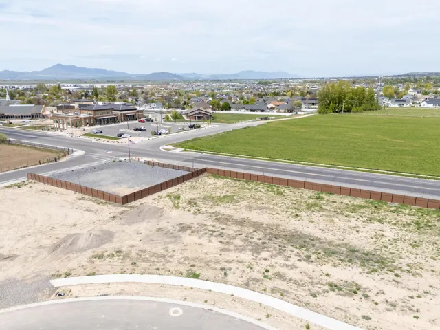 Aerial perspective of suburban area with a mountain backdrop