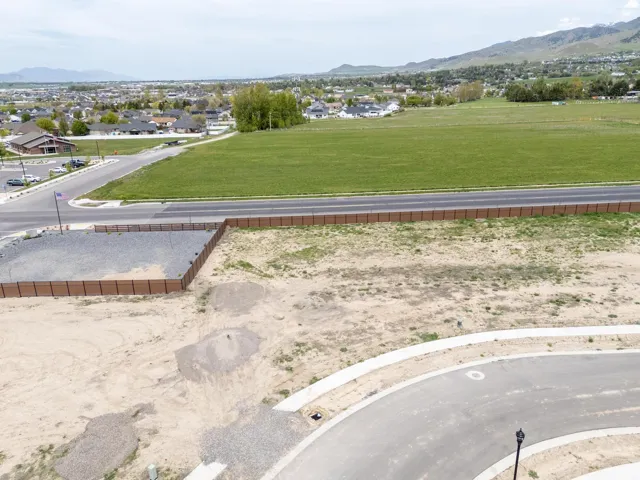 Aerial perspective of suburban area featuring a mountain backdrop