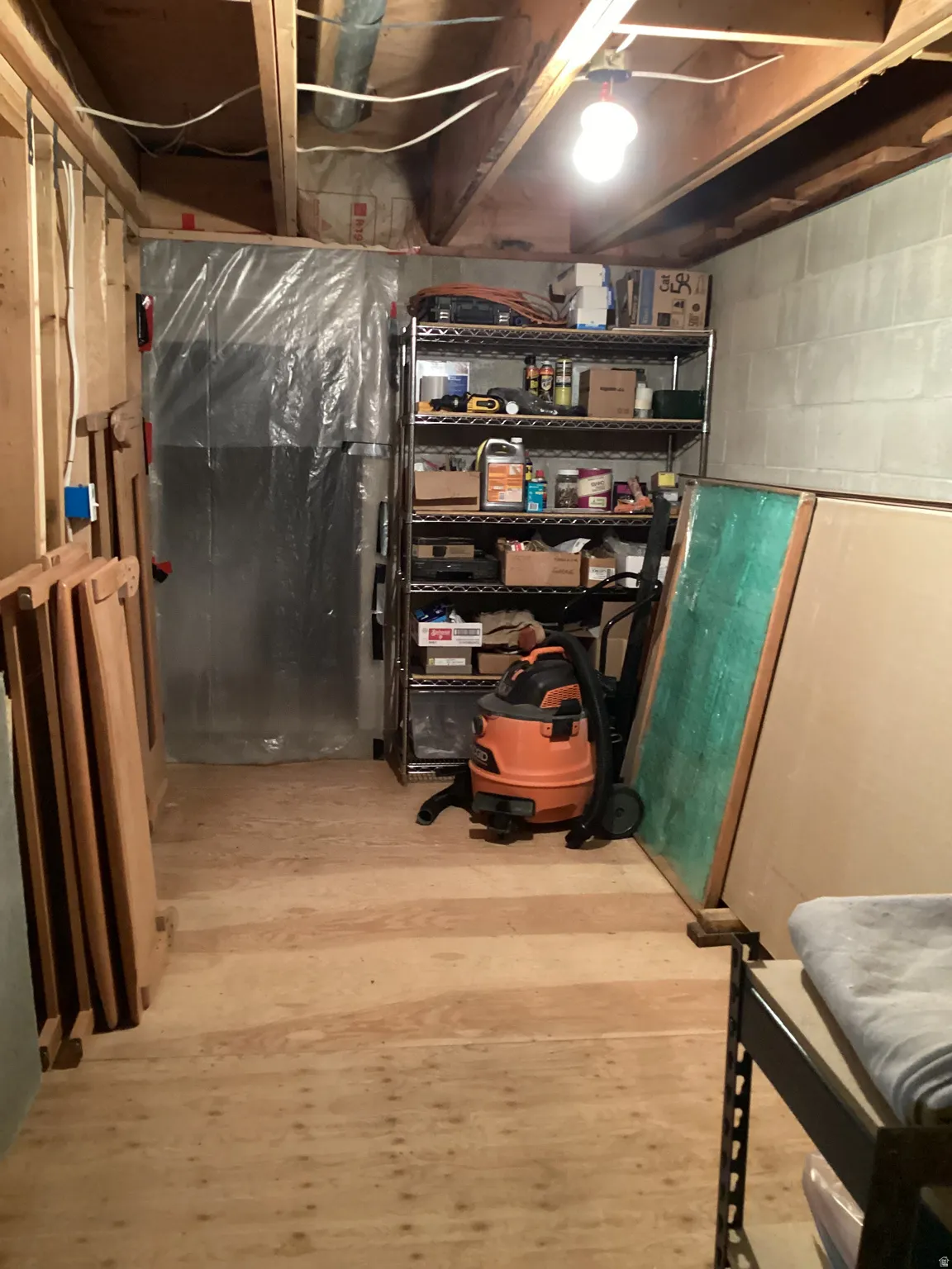 Unfinished below grade area with light wood-style flooring