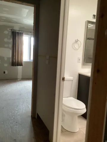 Half bathroom featuring toilet and vanity