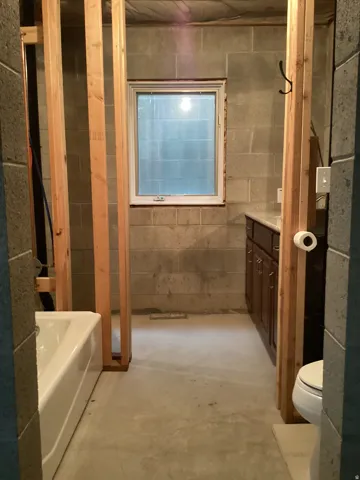 Bathroom featuring vanity and concrete flooring