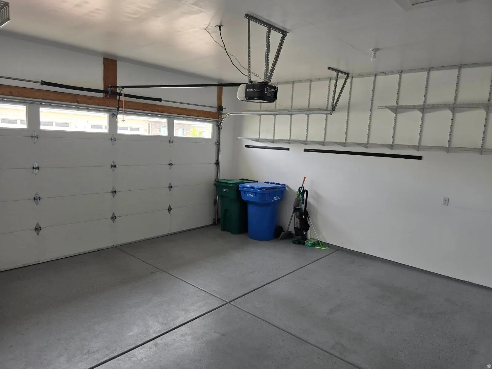 Garage featuring a garage door opener
