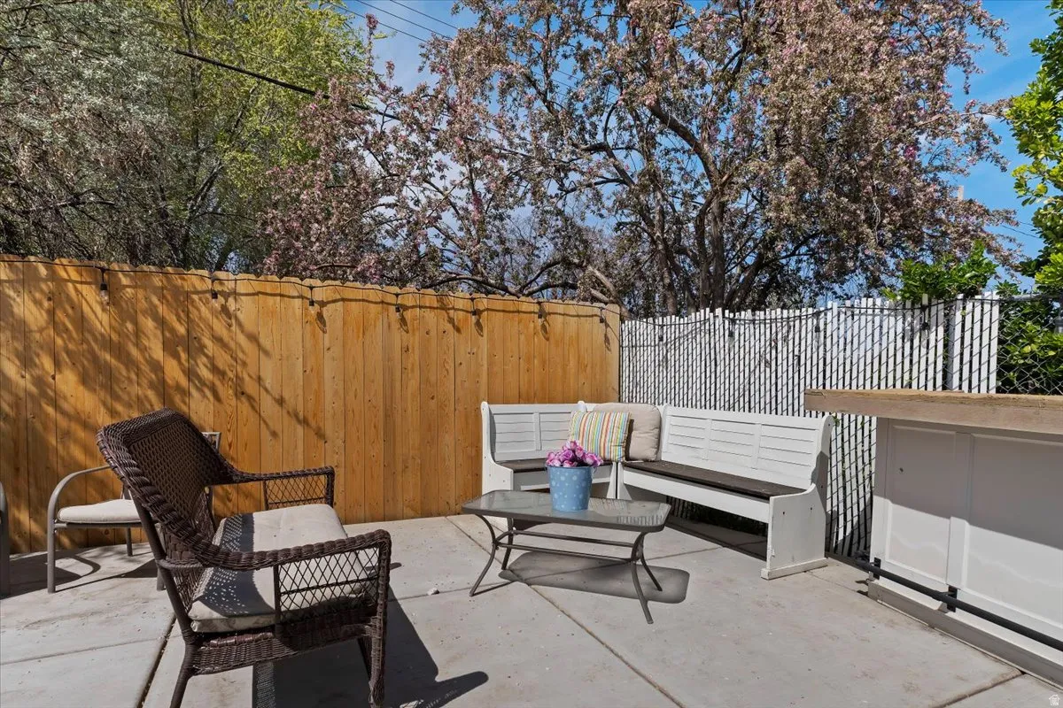 Fenced backyard with a patio area