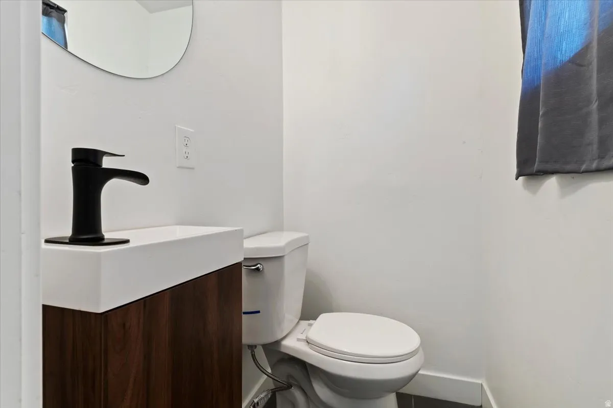 Half bath with vanity and toilet