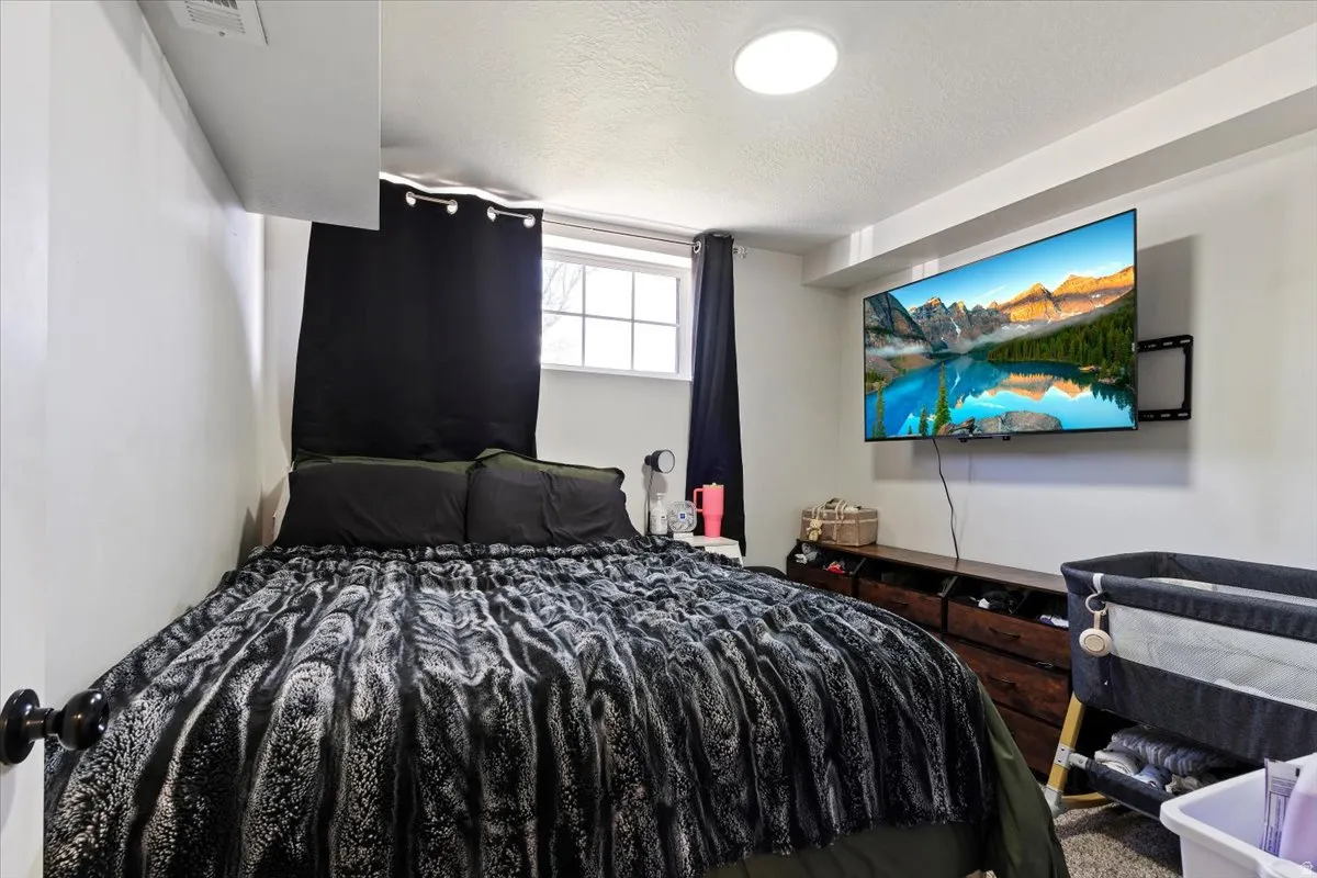 Bedroom featuring a textured ceiling