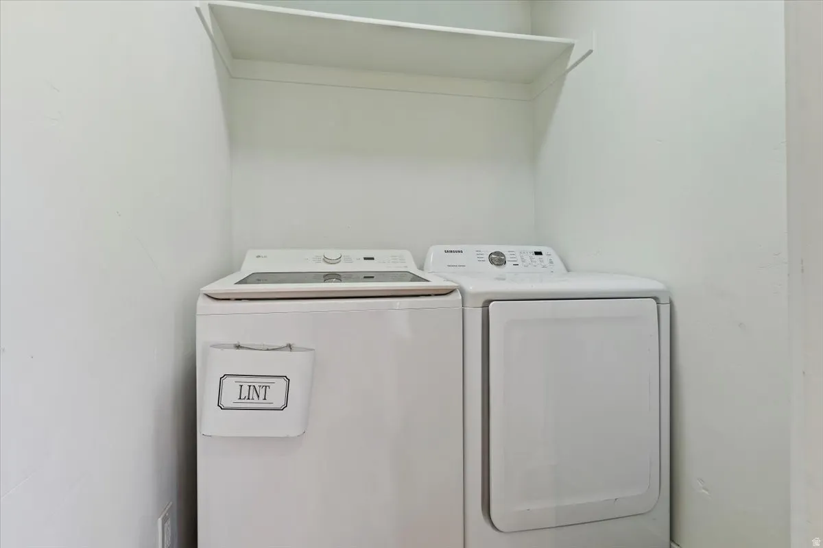 Laundry area featuring washing machine and clothes dryer
