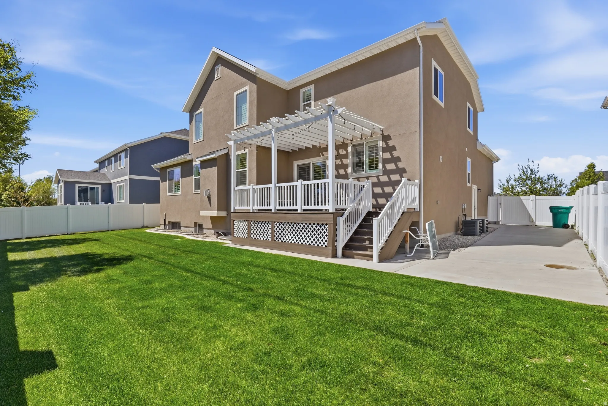 Spacious backyard, large deck, lots of concrete for bball hoop or shed or extra parking