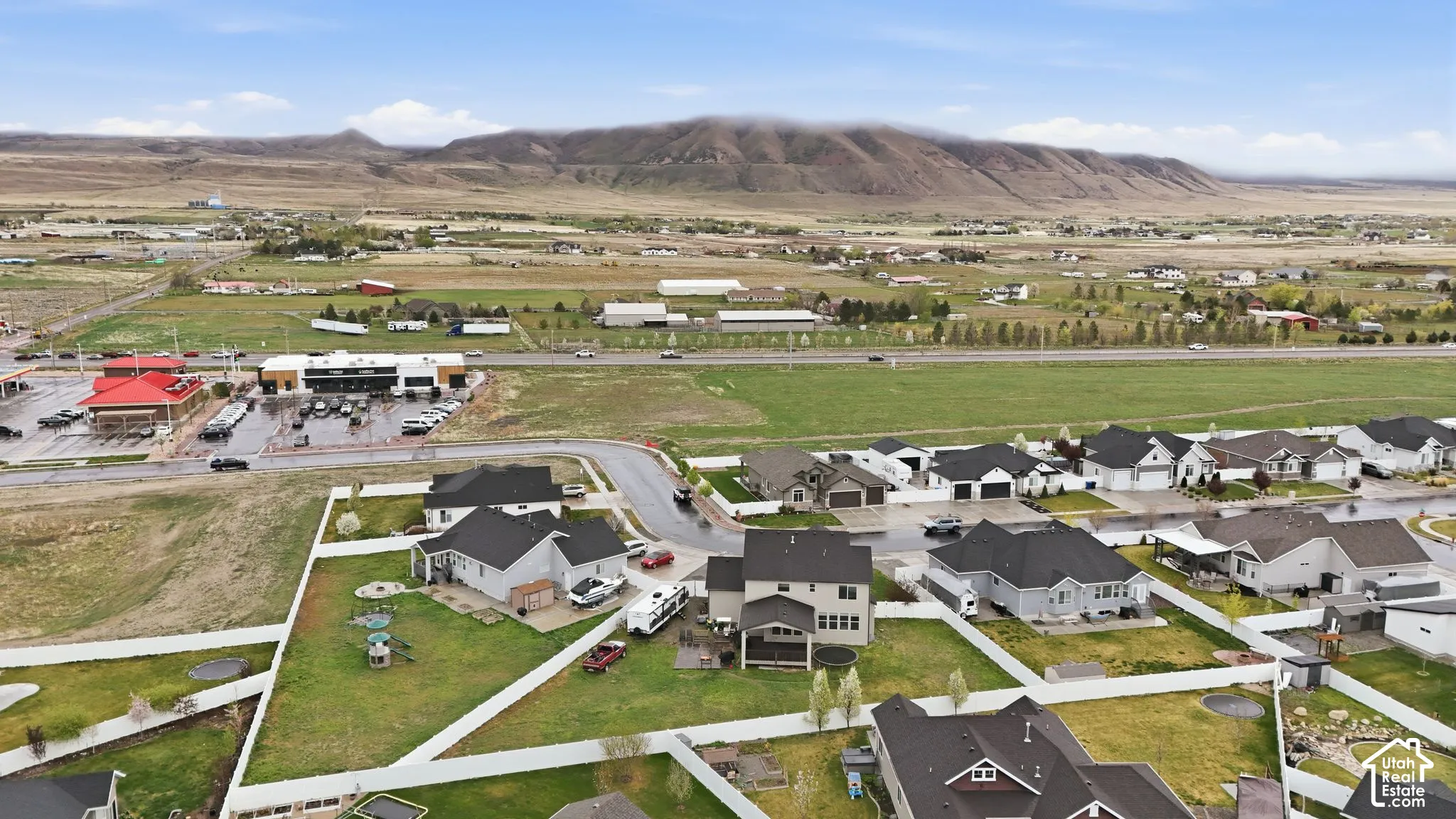 Aerial view of residential area with a mountainous background