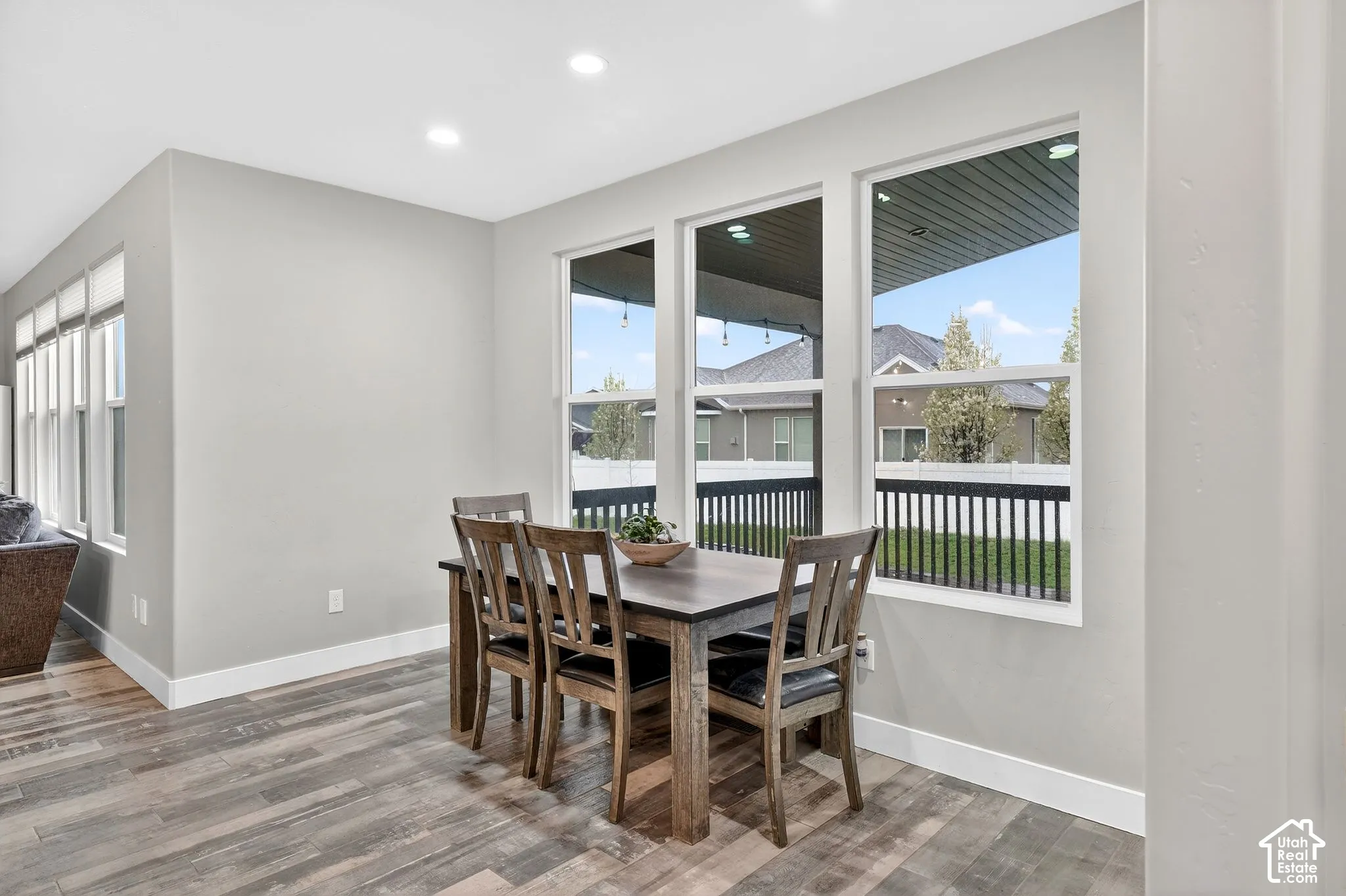 Dining space featuring wood finished floors and recessed lighting