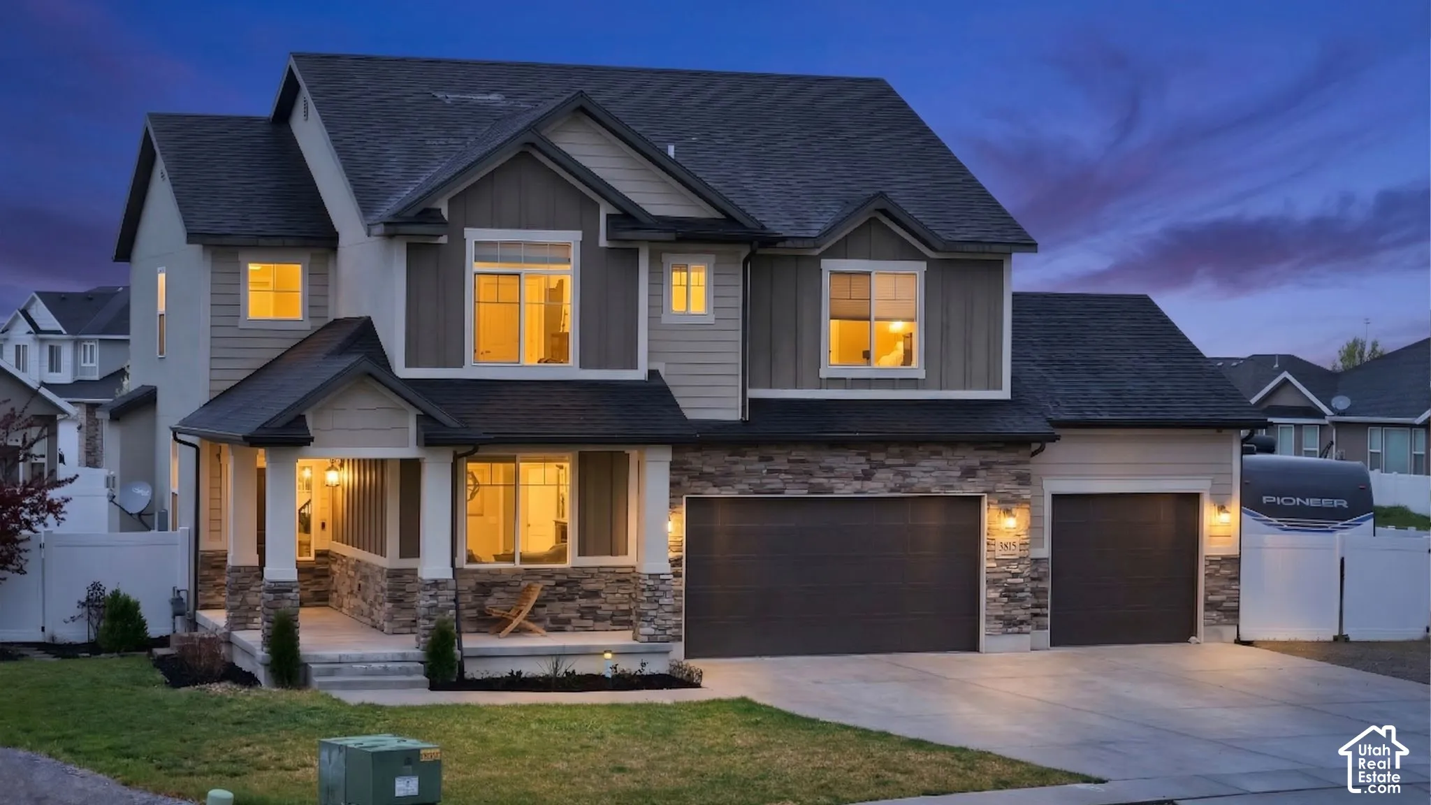 Craftsman inspired home featuring driveway, board and batten siding, a shingled roof, and covered porch