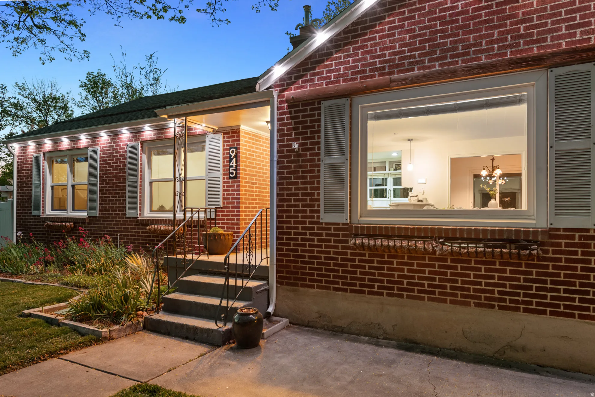 Doorway to property featuring brick siding