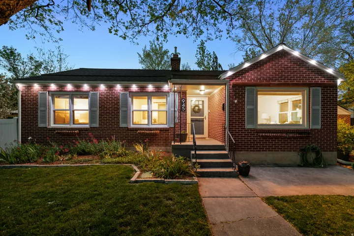 Bungalow featuring brick siding and a chimney