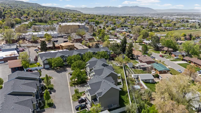 Aerial perspective of suburban area featuring a mountain backdrop