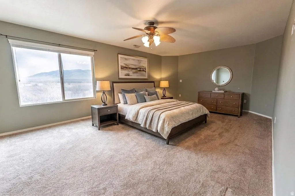 Bedroom featuring carpet flooring and a ceiling fan
