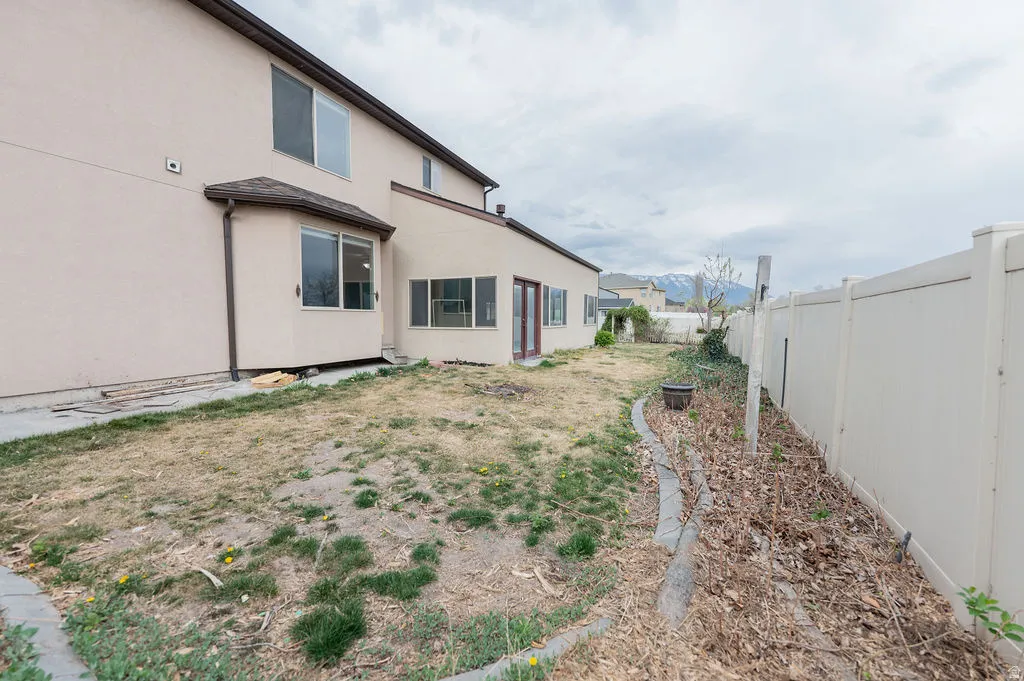View of fenced backyard
