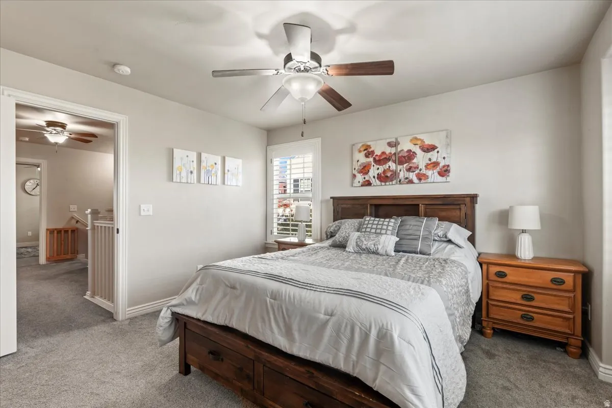 Bedroom with carpet floors and ceiling fan