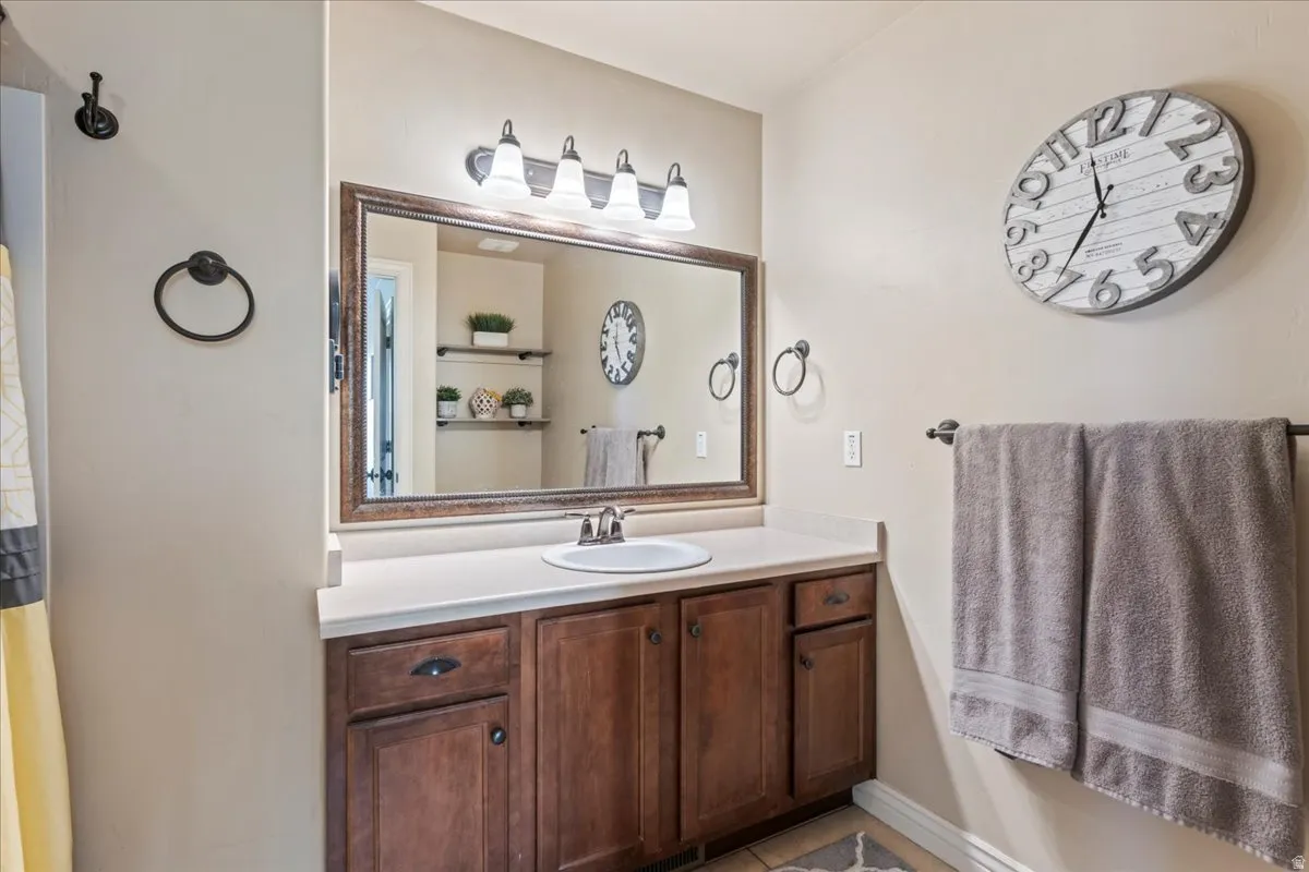 Bathroom featuring vanity and a shower with curtain