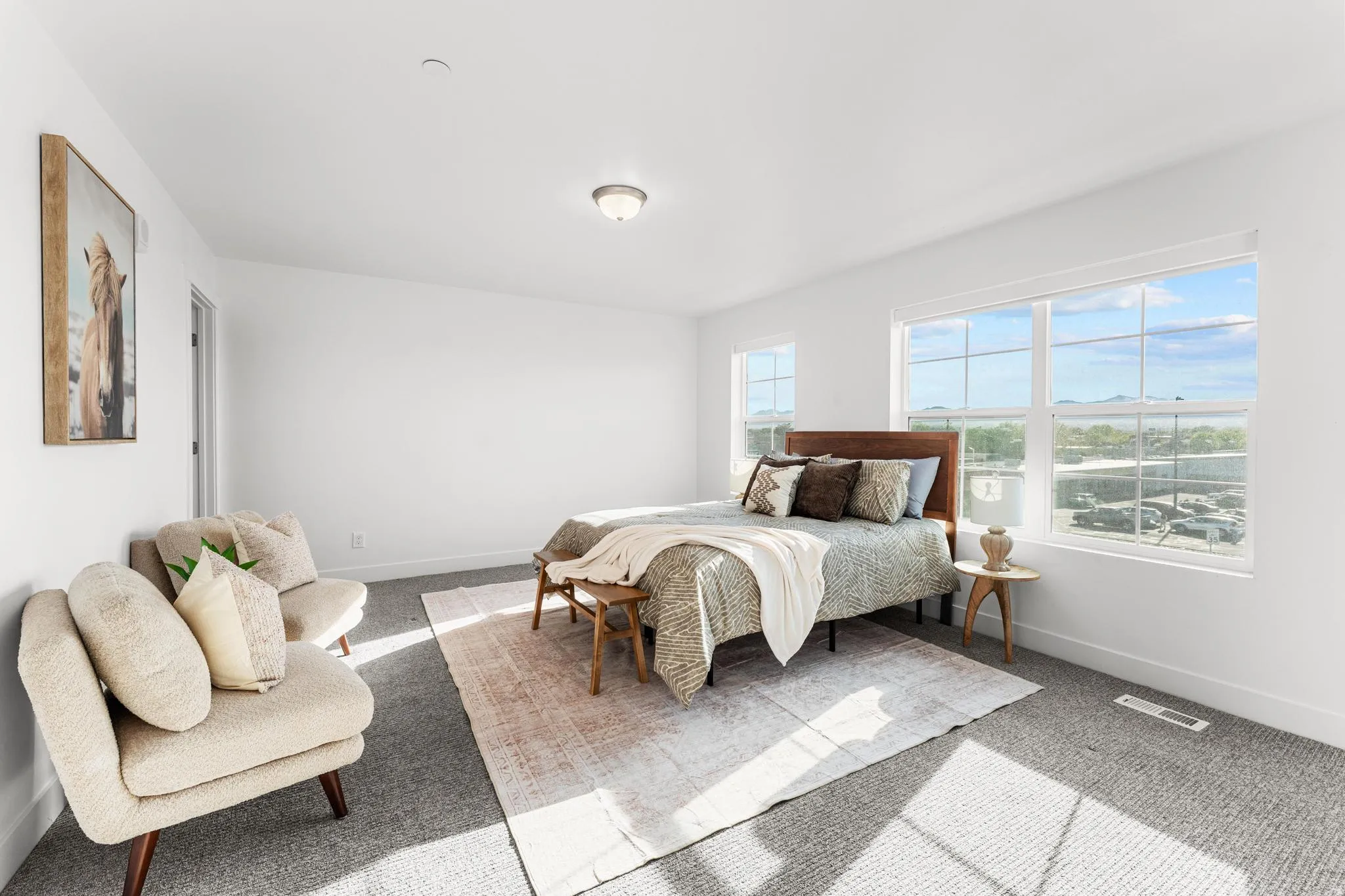 Bedroom with light carpet and baseboards