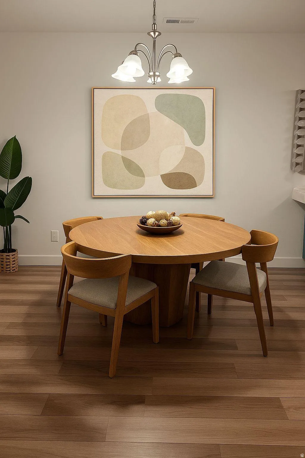 Dining space with wood finished floors and suspended lighting