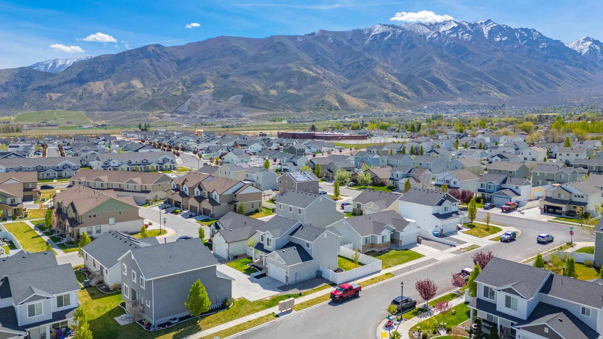 Aerial perspective of suburban area with a mountain backdrop