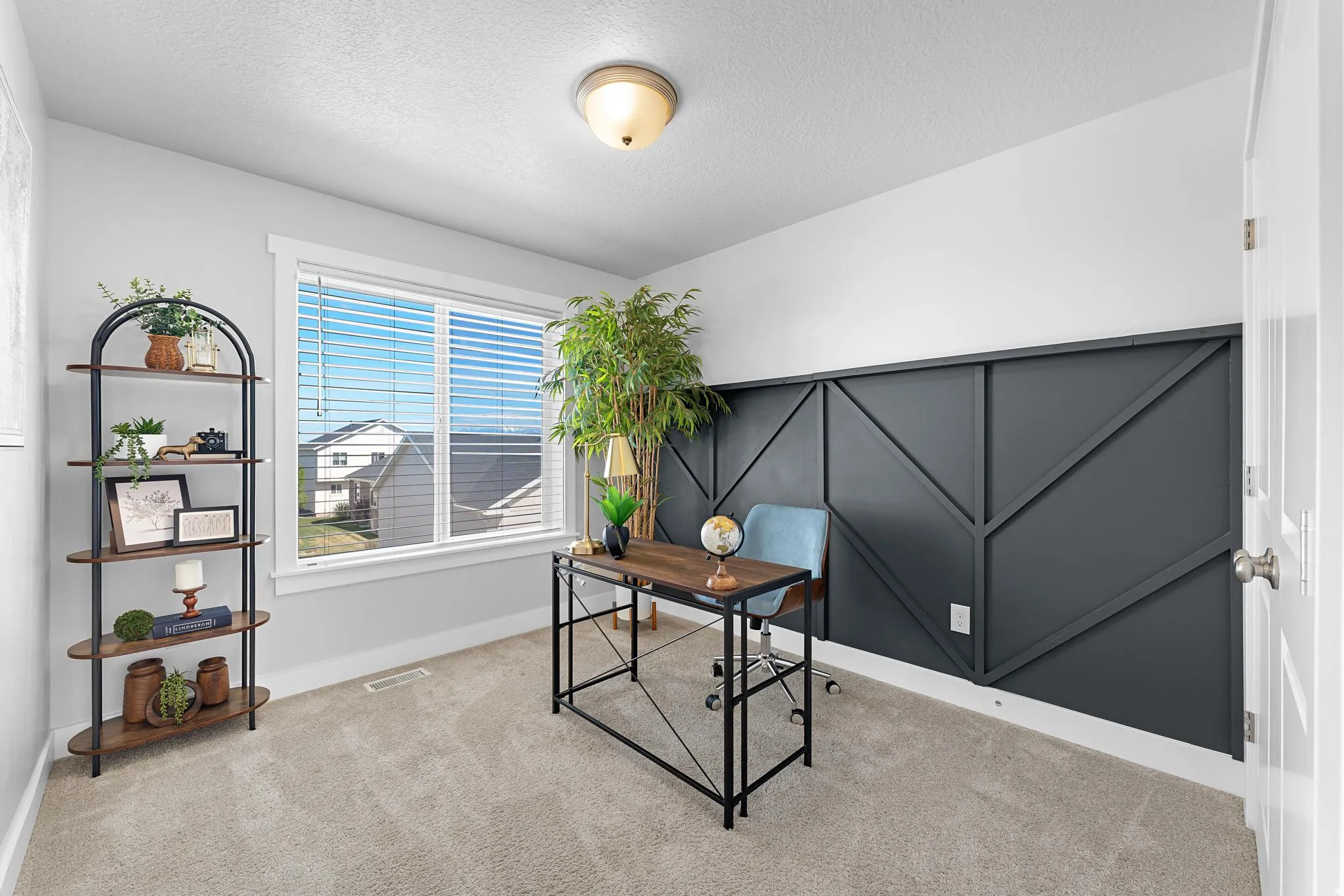 Office featuring carpet flooring and a textured ceiling