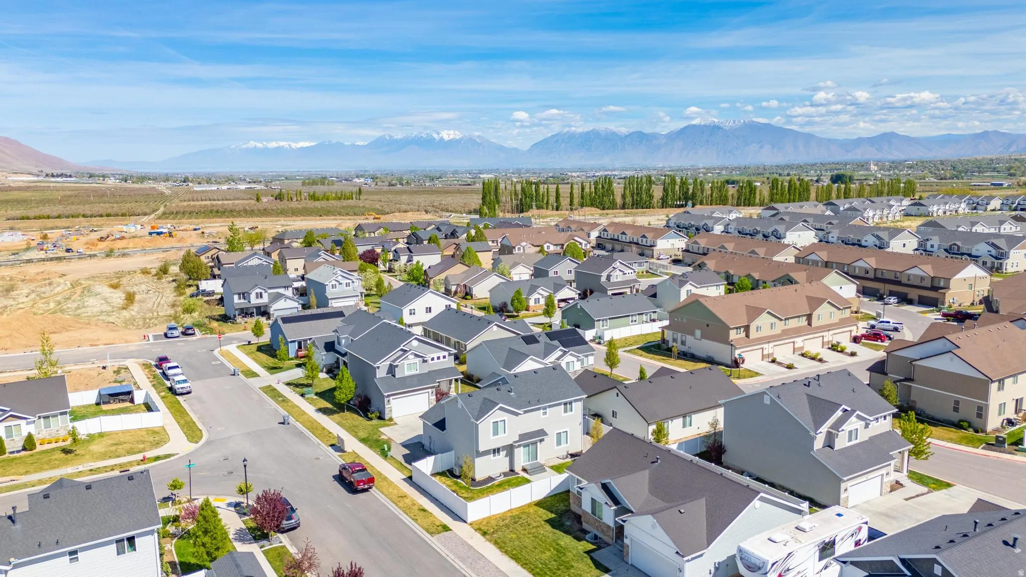 Aerial view of residential area with a mountain backdrop