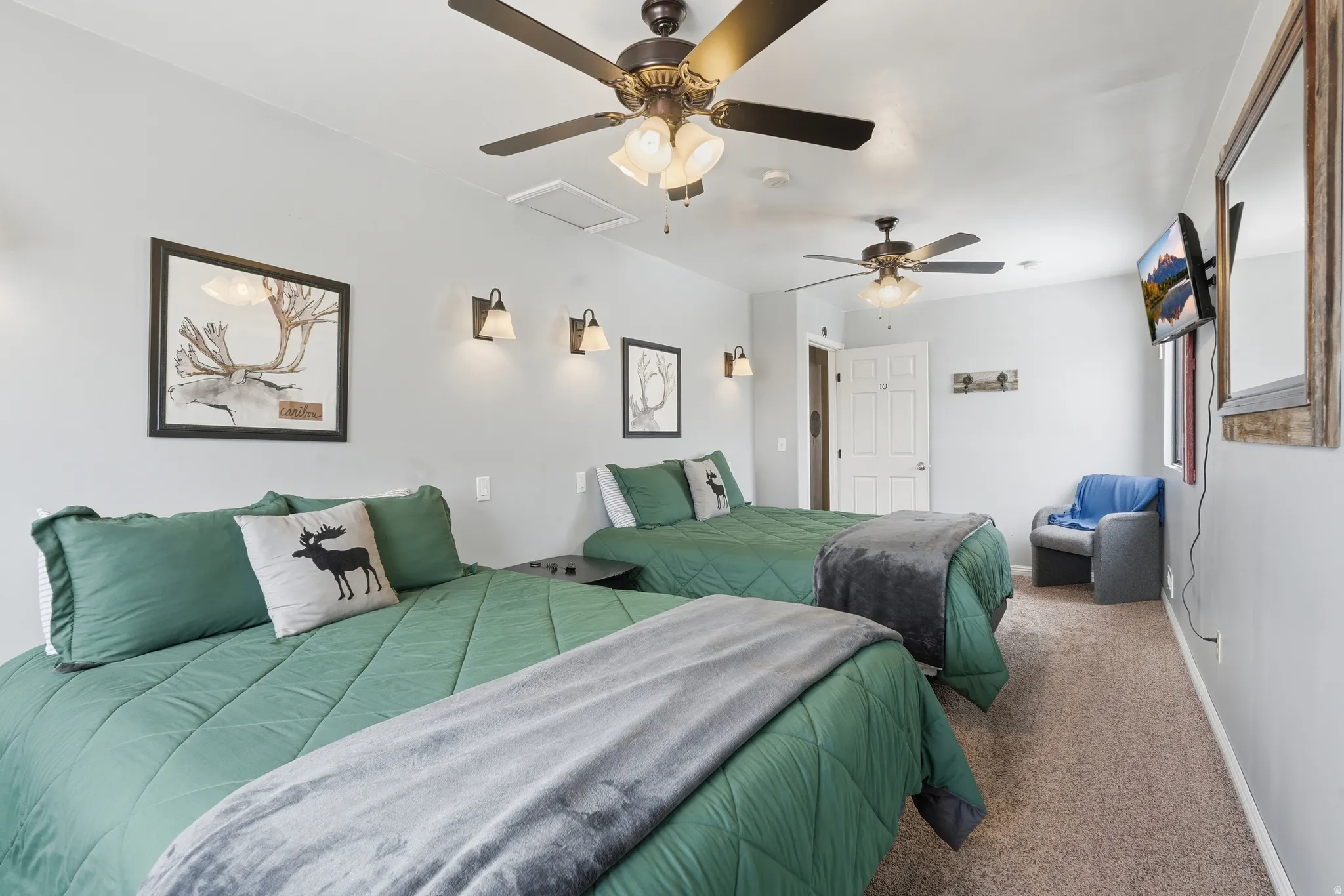 Bedroom with carpet and a ceiling fan