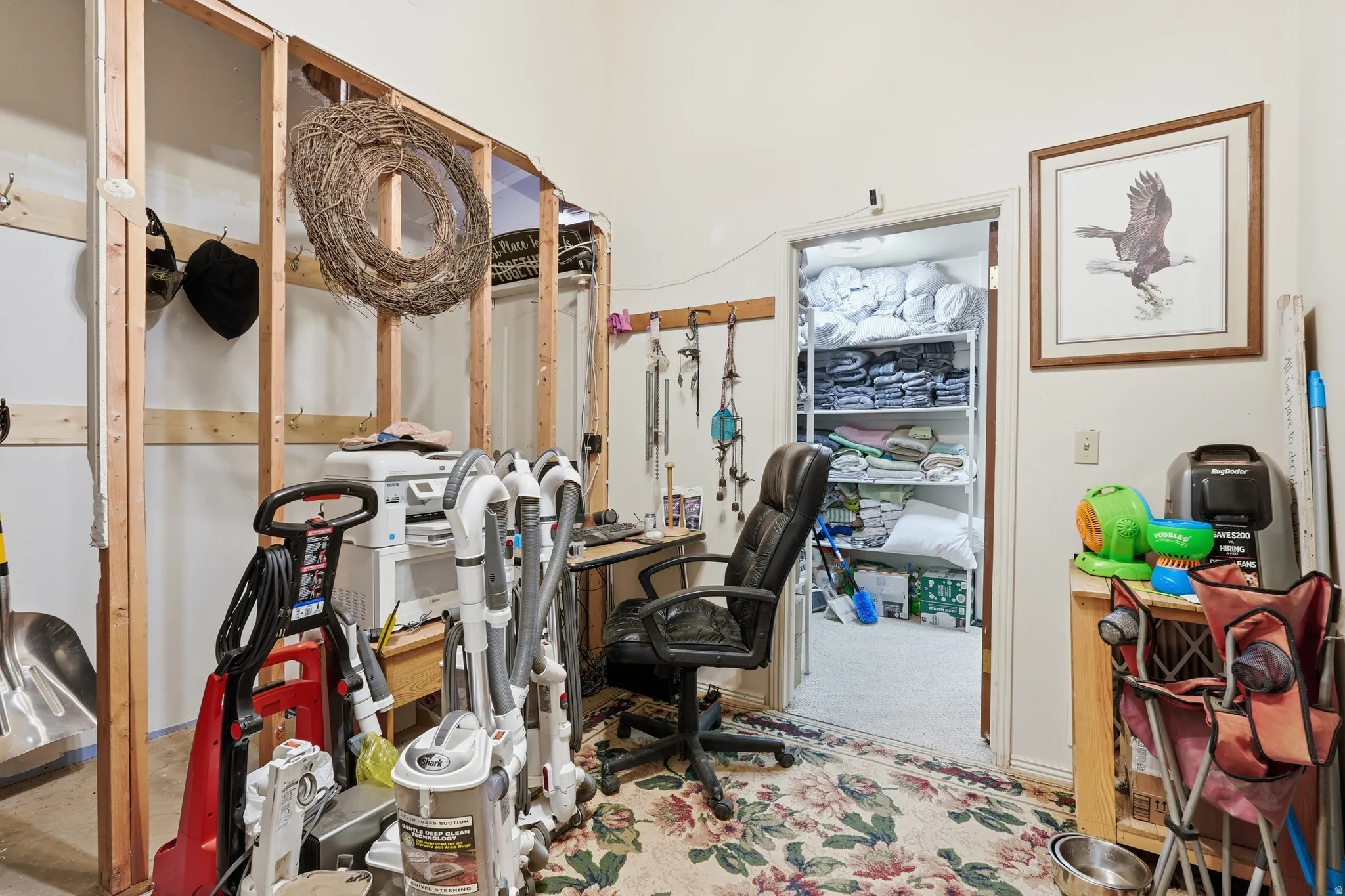 Home office featuring light colored carpet