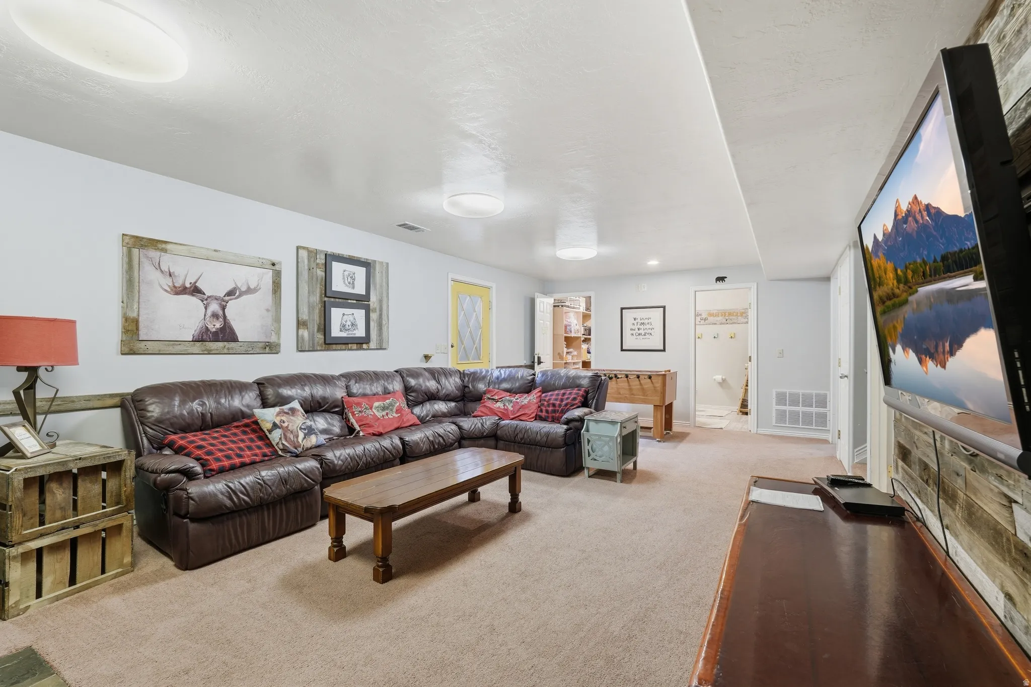 Living room featuring light carpet and baseboards