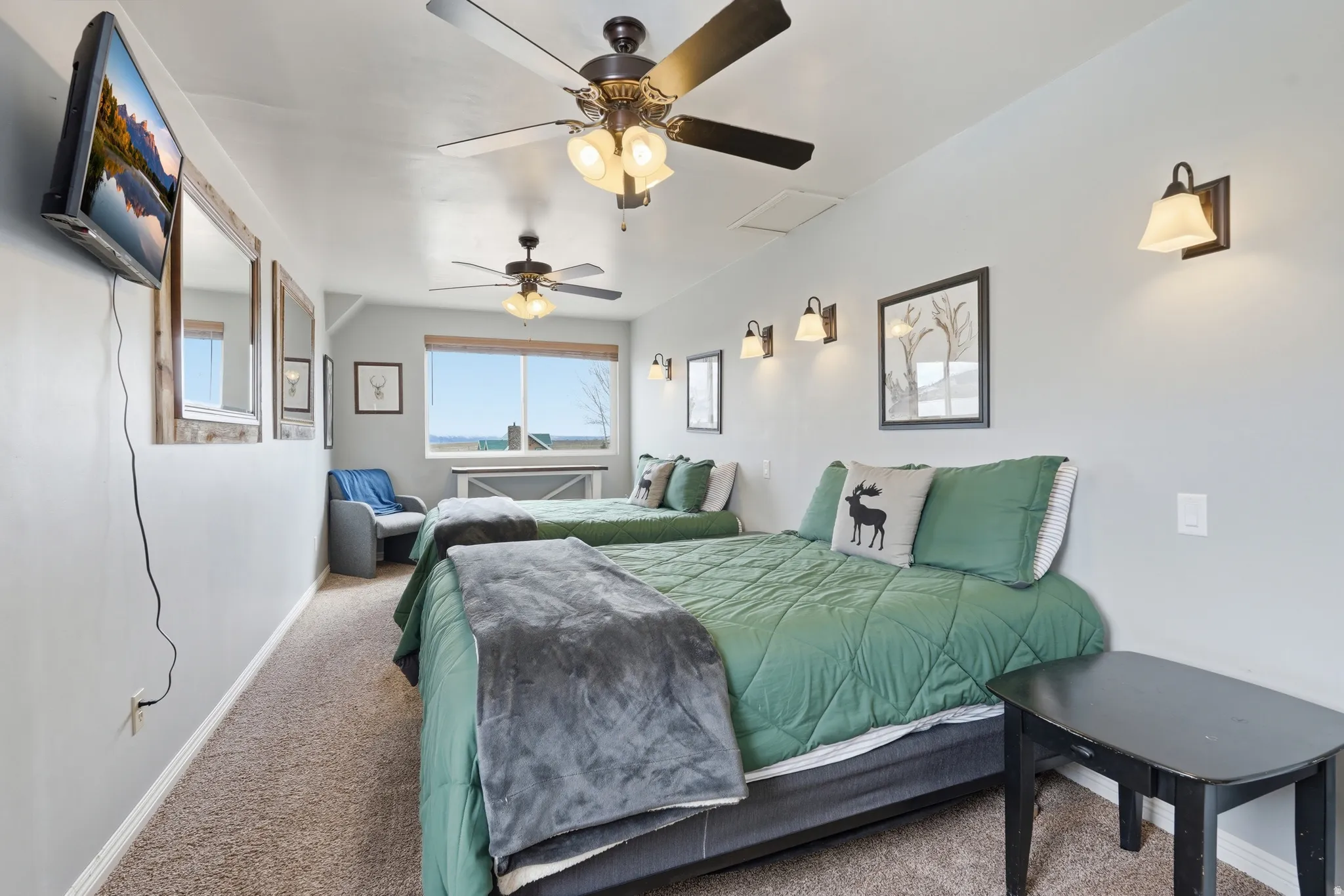 Bedroom with carpet flooring and a ceiling fan