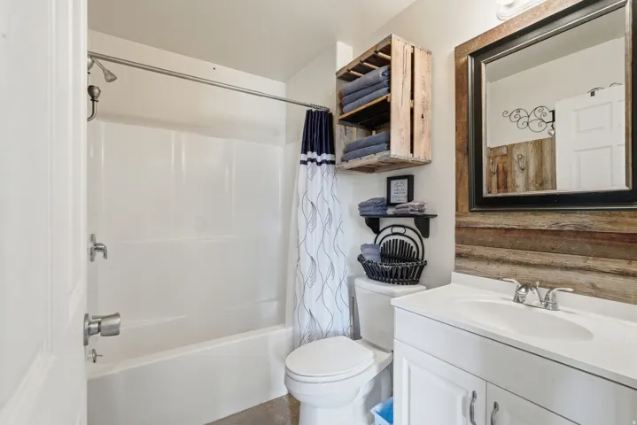 Bathroom with vanity and shower / bath combo