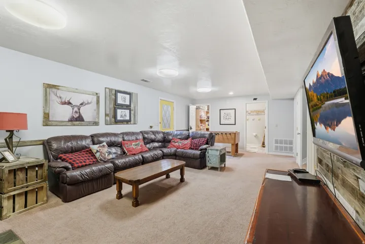 Living room featuring light carpet and baseboards