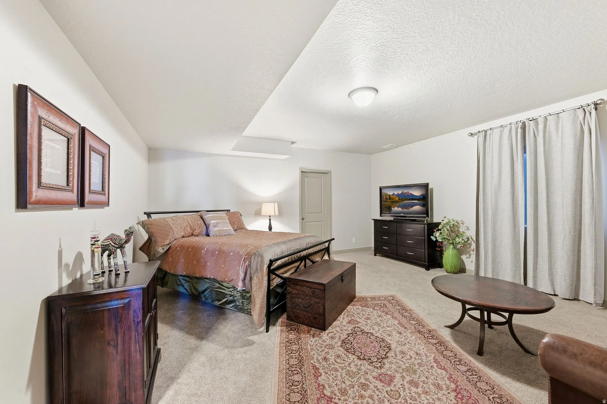 Bedroom #3 with Ensuite bathroom in basement, featuring light carpet
