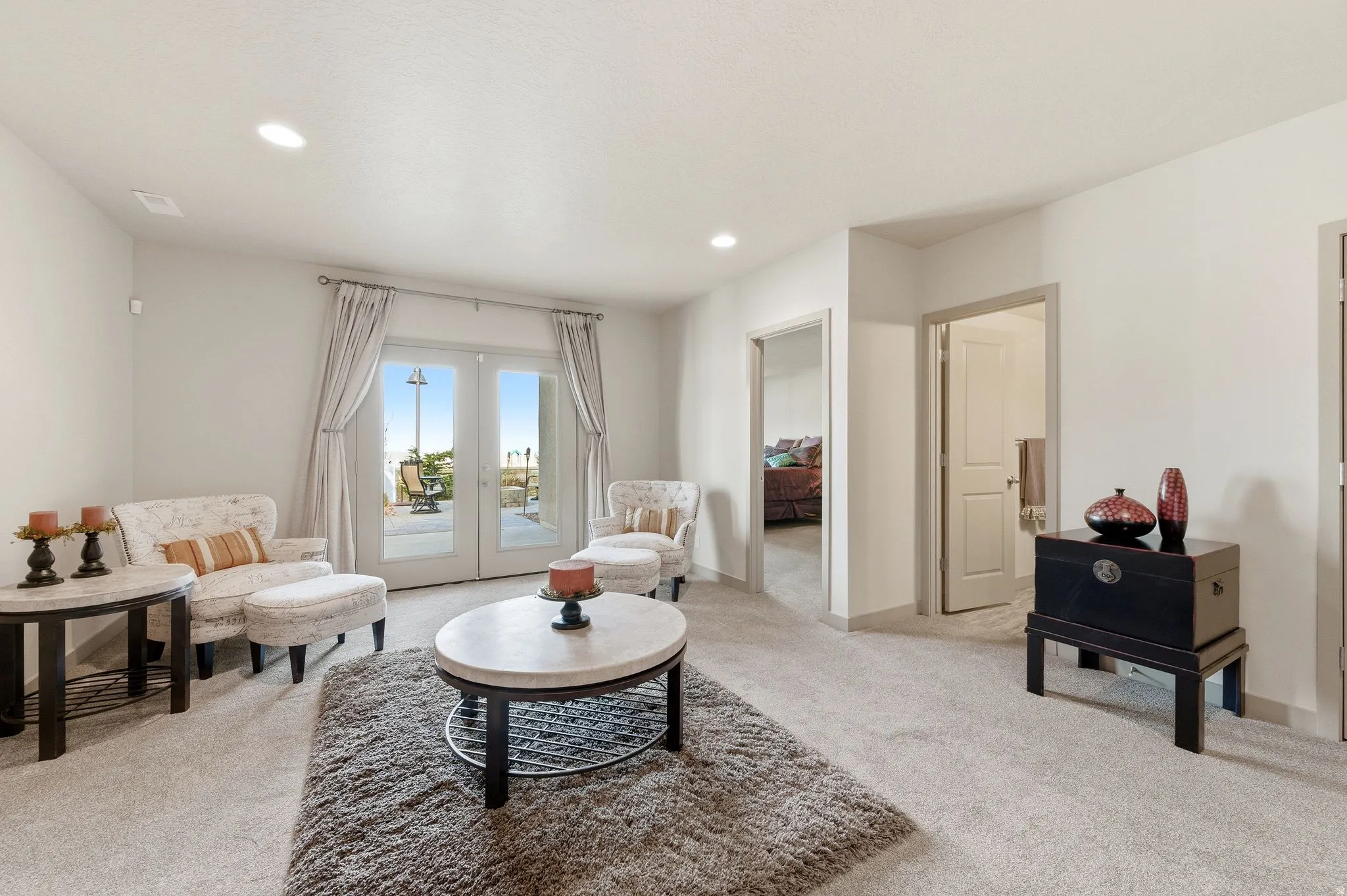Basement living area featuring french doors to back patio
