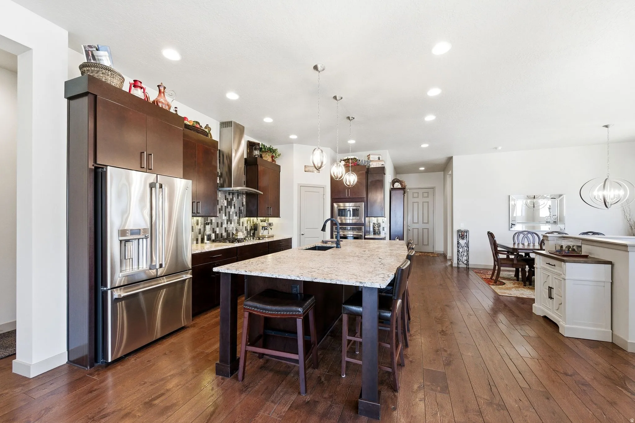 Kitchen with pantry, front entrance, and formal dining area.