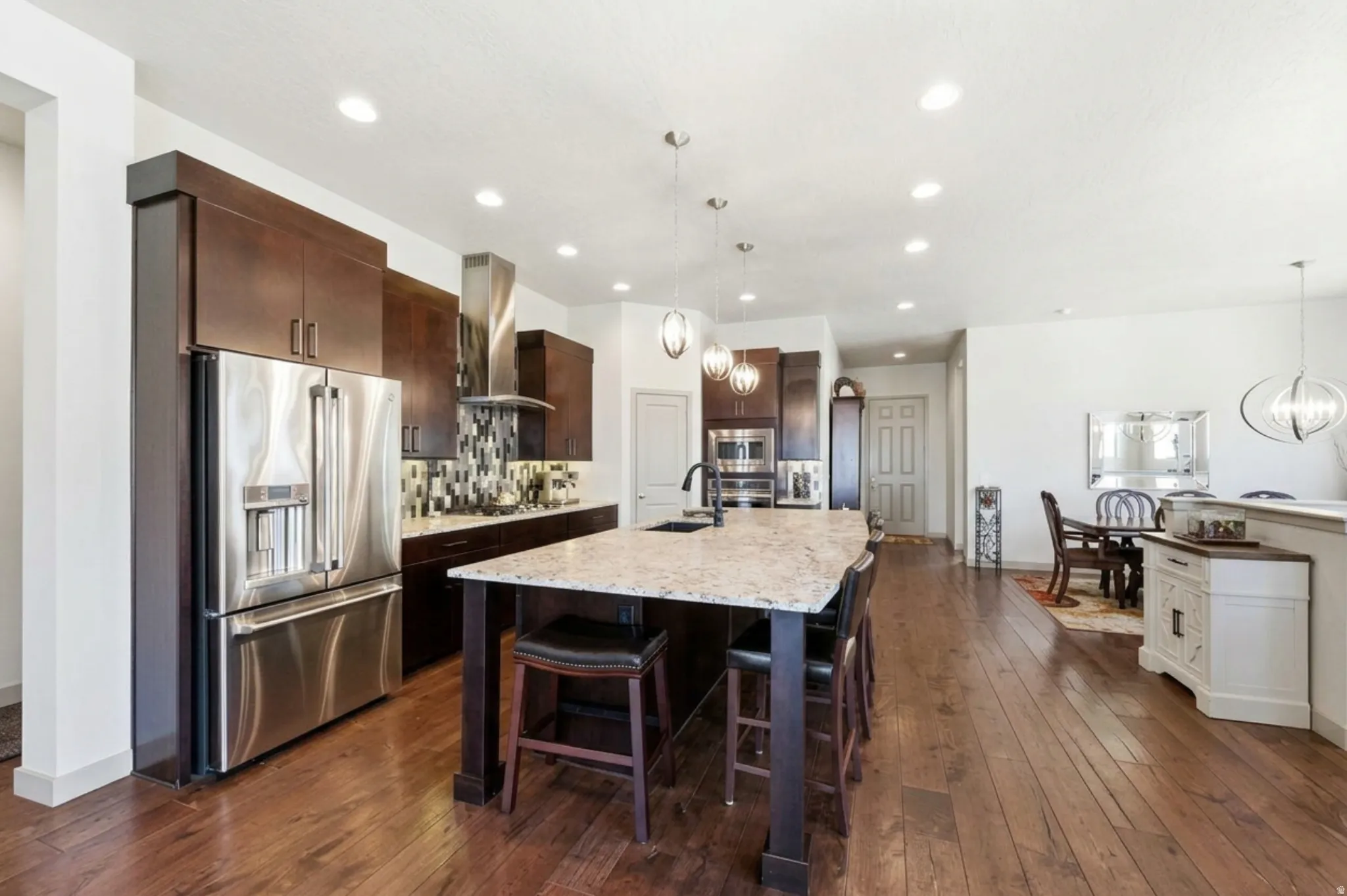 Kitchen with pantry, front entrance, and formal dining area and LOTS of natural light.
