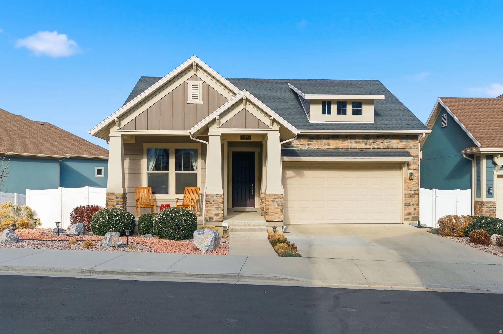 Deceptively large modern Craftsman home featuring 3-car garage, 2-deep on one end, and Xeriscaped yard.