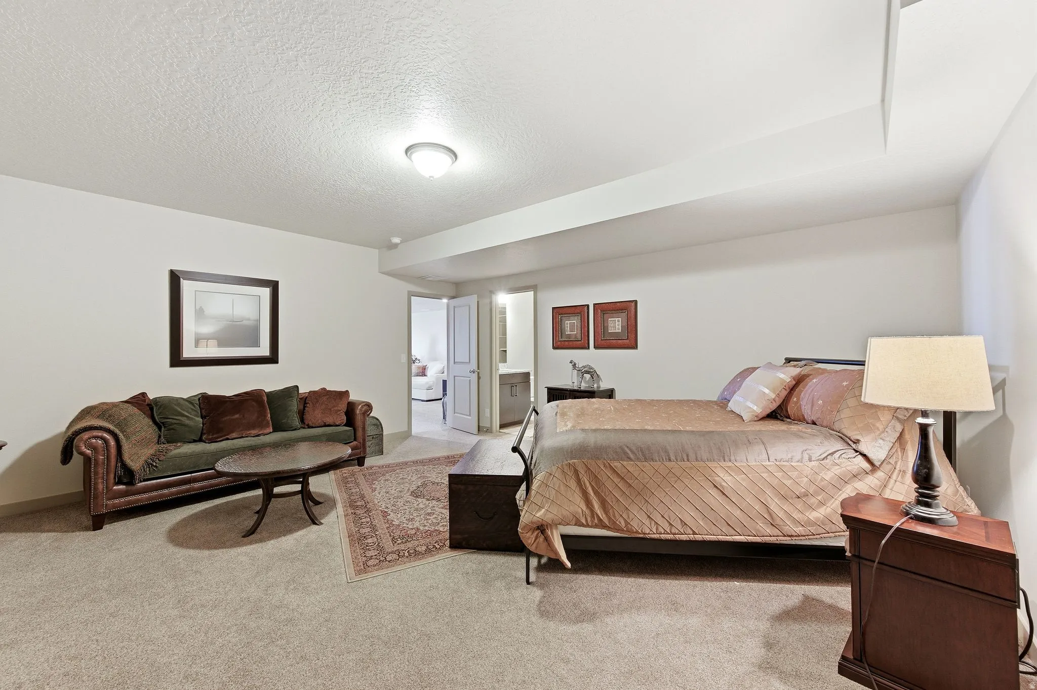Bedroom #3 with Ensuite bathroom in basement, featuring light carpet