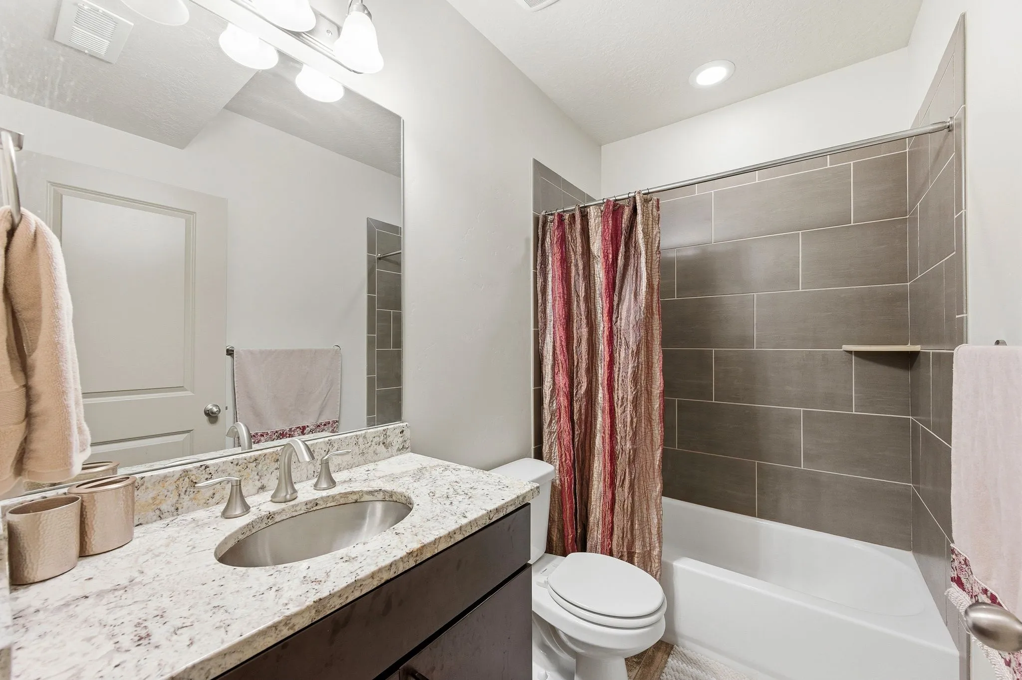 Bedroom #3 Ensuite bathroom featuring combined tub and shower