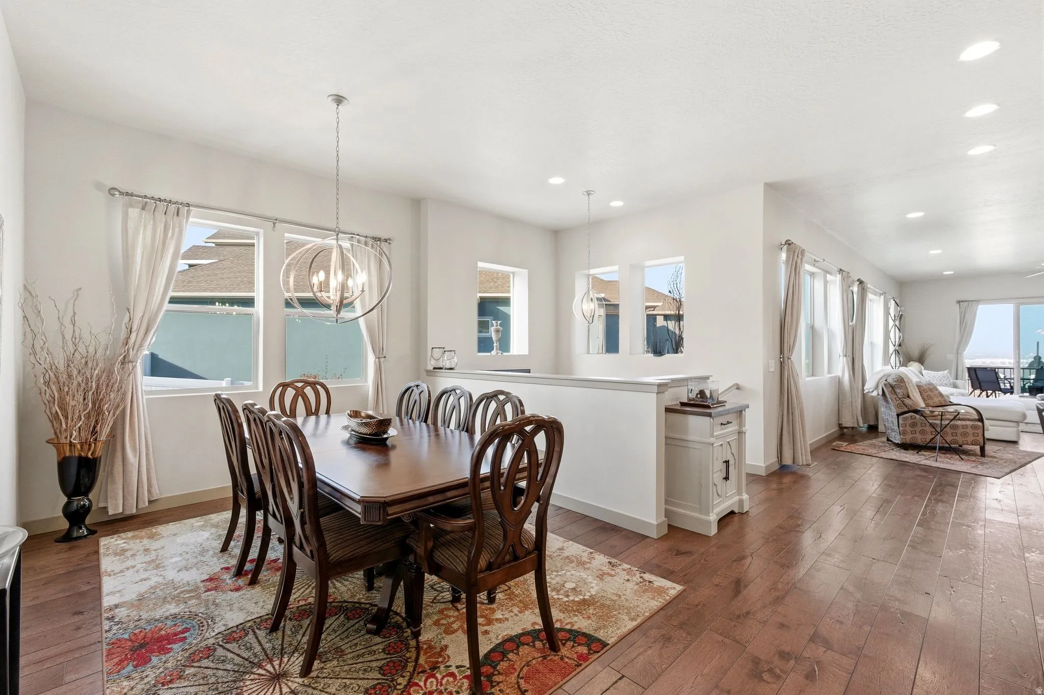 Formal dining area, stairs to basement, and area for small table in great room.