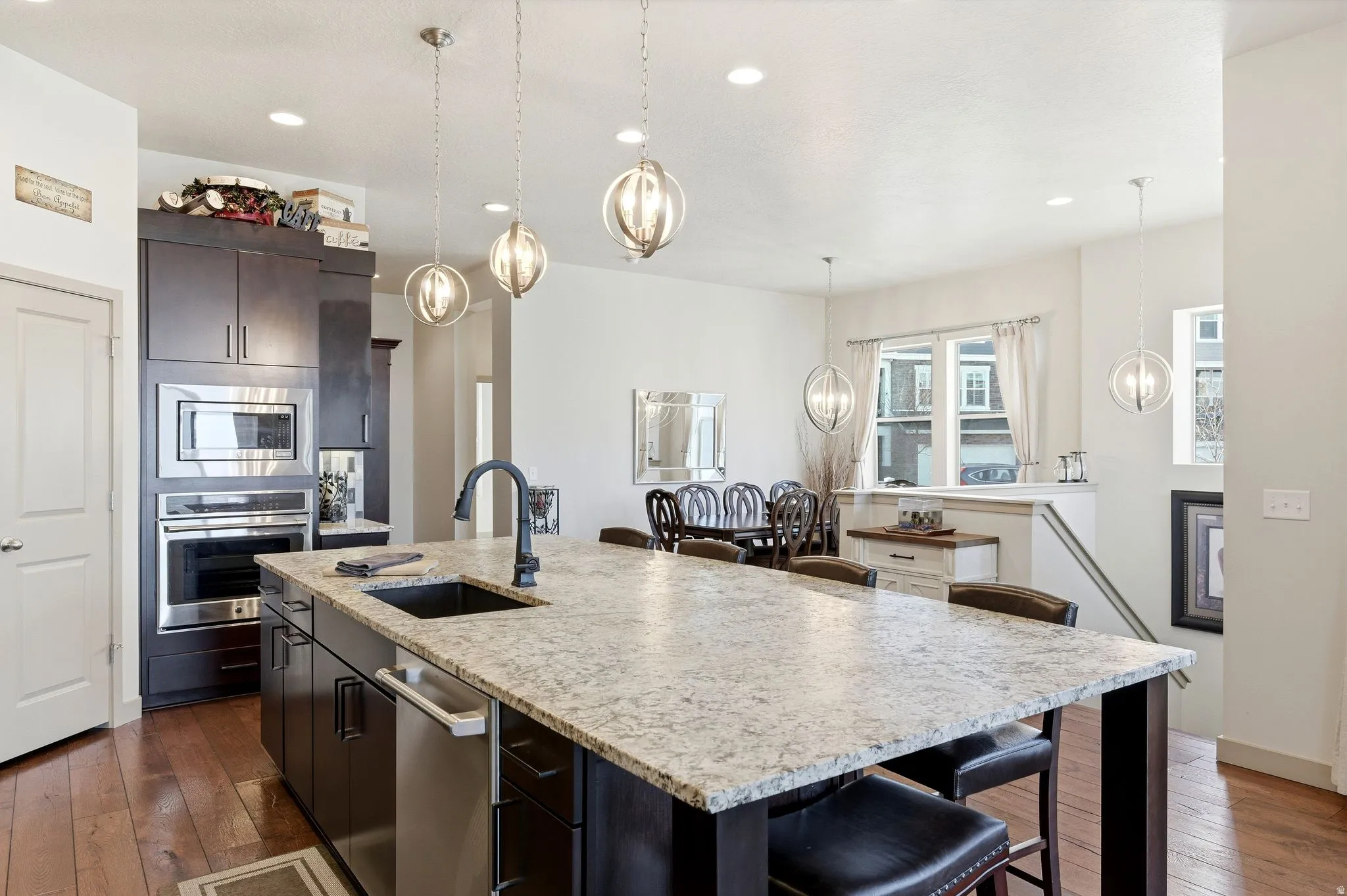 Kitchen, formal dining, and stairs to basement.