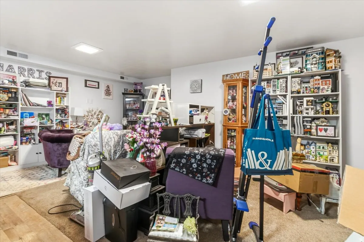 Living area featuring light colored carpet