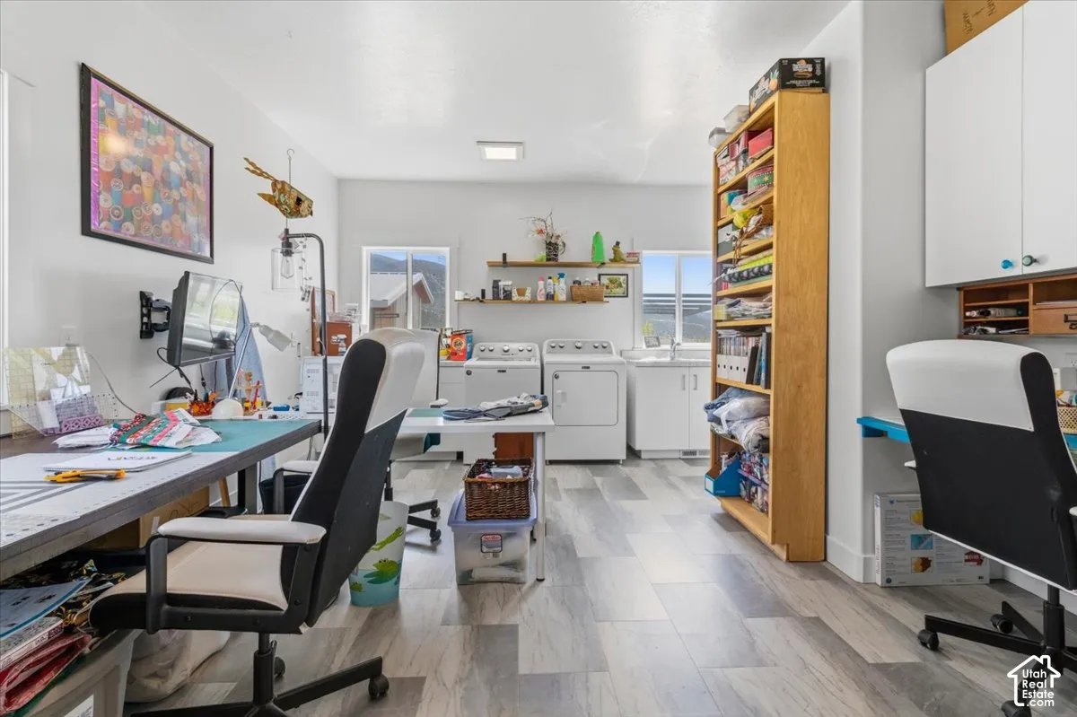 Home office with plenty of natural light and independent washer and dryer