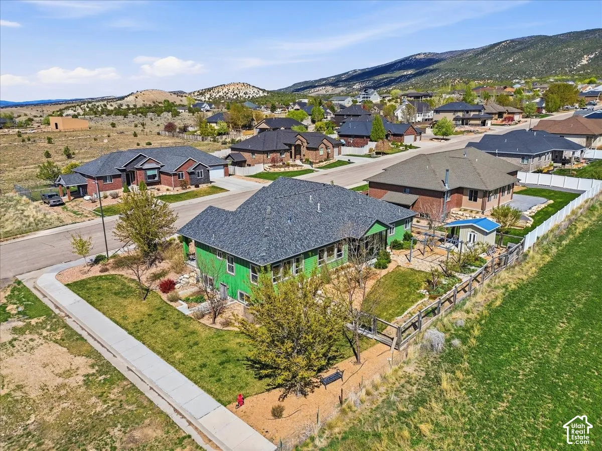 Aerial perspective of suburban area with a mountain backdrop