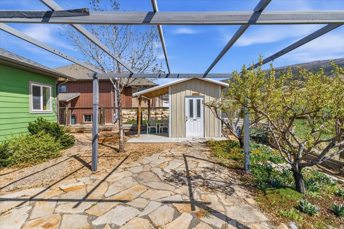 View of patio / terrace with an outbuilding and a lanai