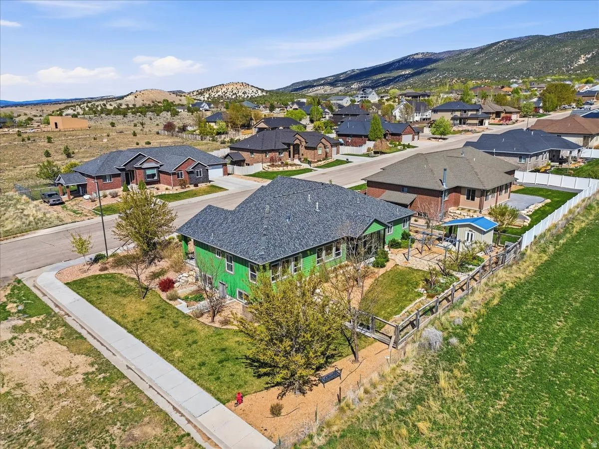Aerial perspective of suburban area with a mountain backdrop